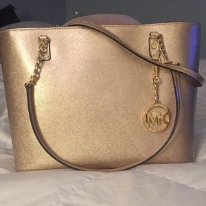 Michael Kors gold pocket book